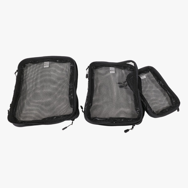 Scicon compression packing cube set showing multiple organized cubes in various sizes for efficient travel packing.